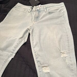Light blue distressed Jean skinny size 32